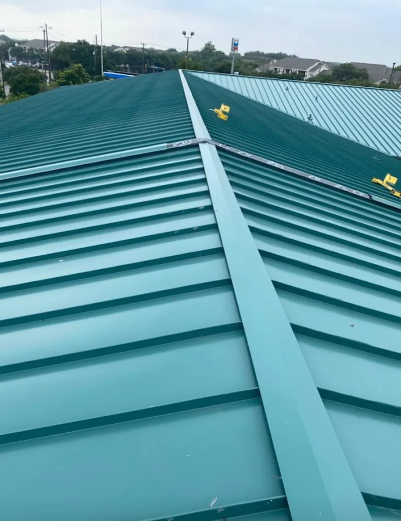 Green commercial metal roof ridge and valley for Metal Roof Repair in Oakhurst